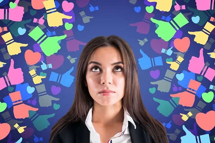 Woman surrounded by colorful social media icons, thinking