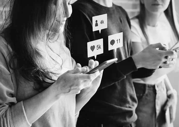 People using smartphones with social media notifications