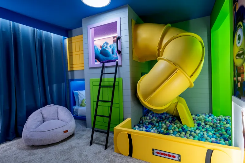 Themed kids' room with a slide and ball pit